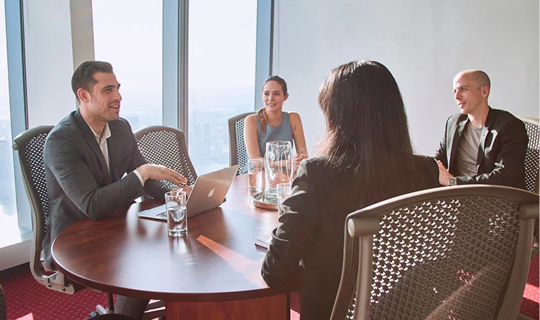 Premium meeting room at 1717 Pennsylvania Avenue, Chicago, where clients engage in a productive meeting.