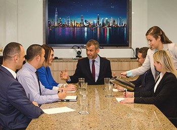Meeting room at Williams Tower, Houston, where clients engage in productive discussions in a professional setting.